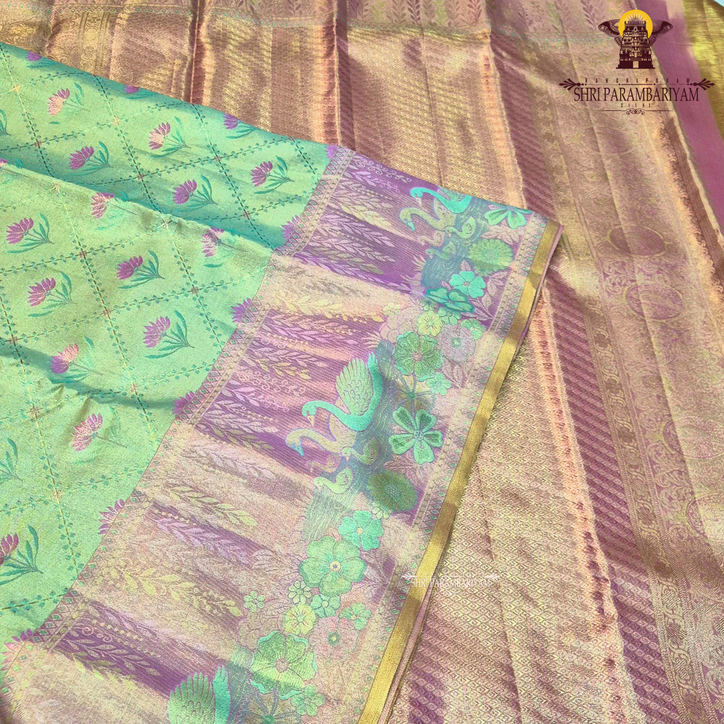 A beautiful dual-tone blend of pastel pista green and soft lavender pink Saree