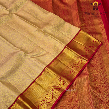 A soft peach gold shade with an elegant self floral jacquard Saree