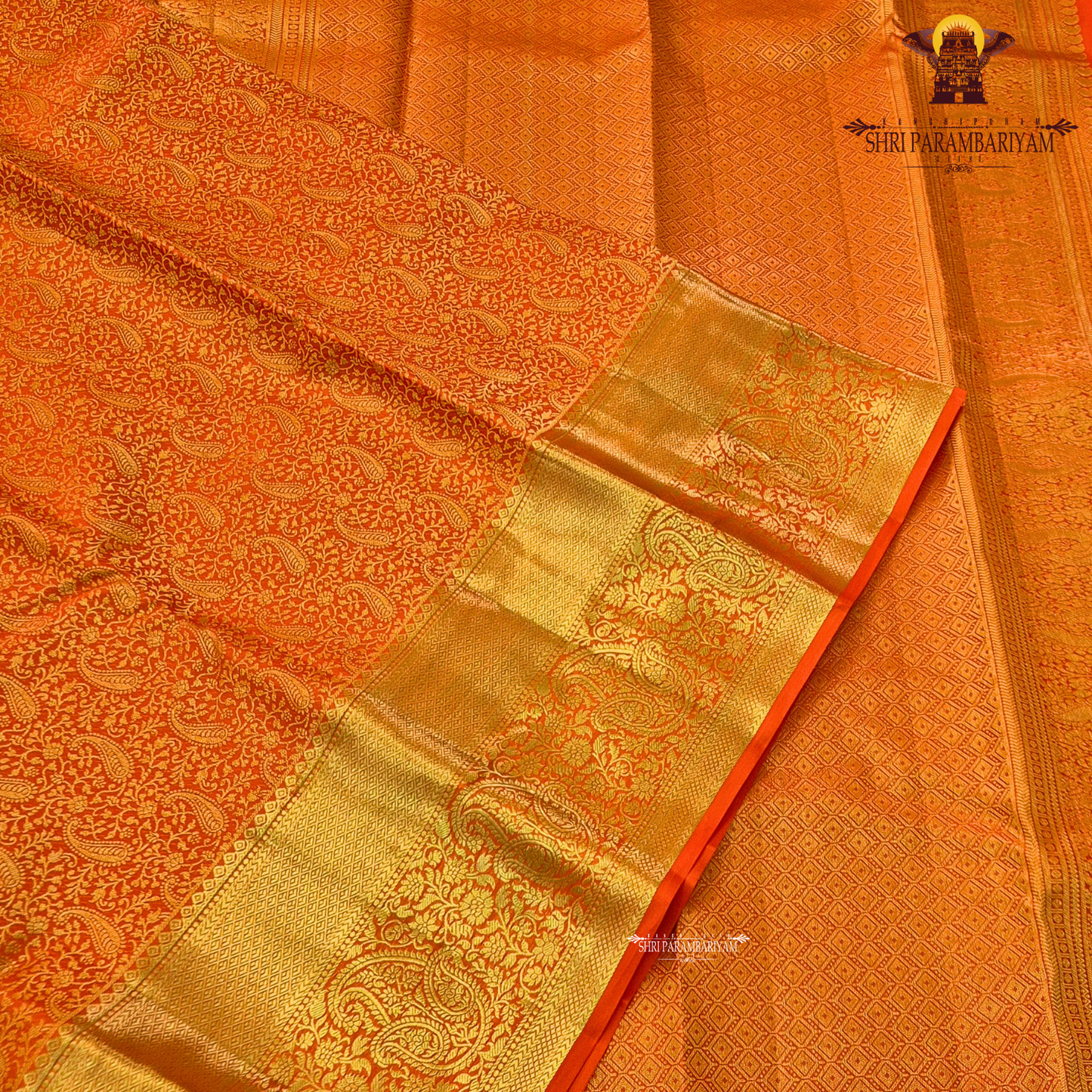 Bright vermilion orange / reddish orange with rich gold zari Saree