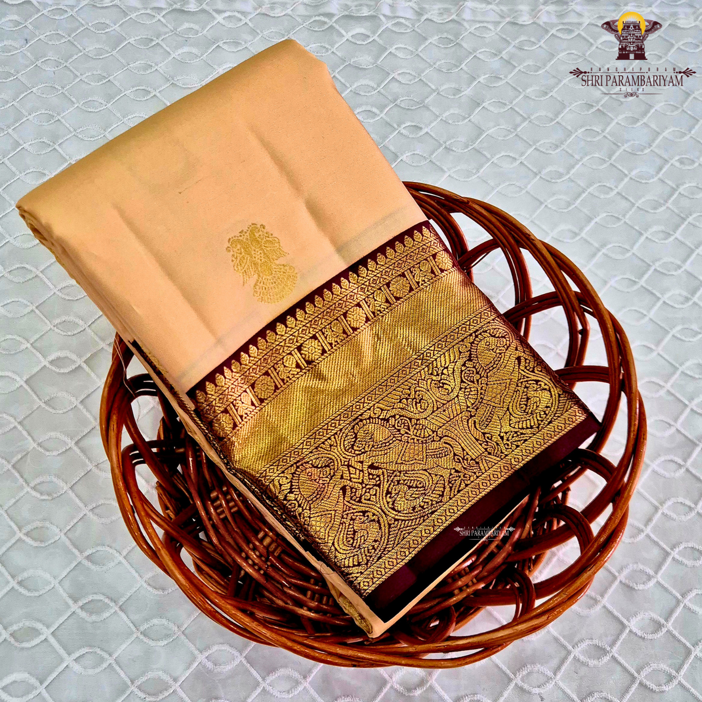A elegant Cream Beige / Soft Sandal body with a rich Maroon Korvai Border Saree