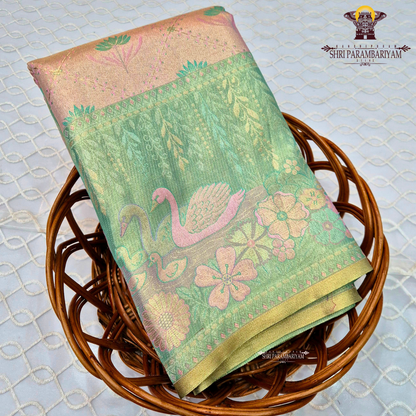 An elegant dual-tone combination of pastel peach and refreshing mint green Saree