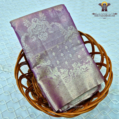 A beautiful lavender purple shade enhanced with a shimmering silver tissue finish Saree
