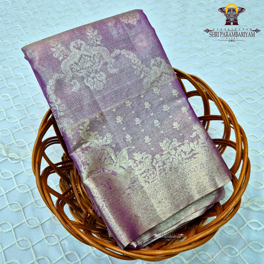 A beautiful lavender purple shade enhanced with a shimmering silver tissue finish Saree