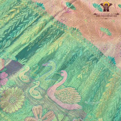 An elegant dual-tone combination of pastel peach and refreshing mint green Saree