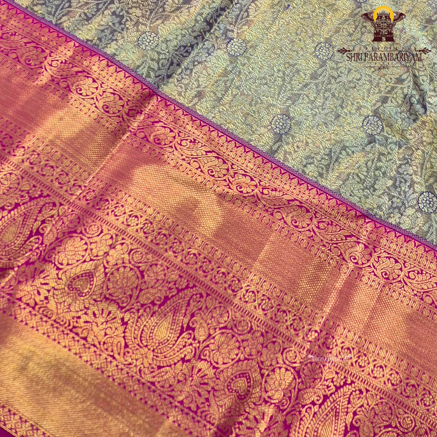 A sophisticated antique gold / champagne gold tissue body paired with a vibrant bright rani pink border Saree