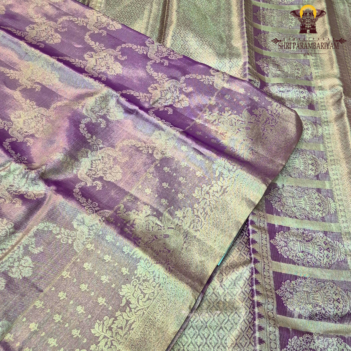 A beautiful lavender purple shade enhanced with a shimmering silver tissue finish Saree