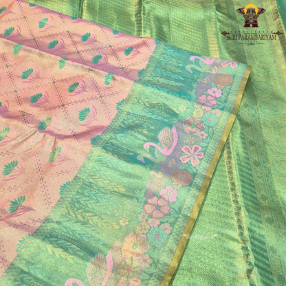 An elegant dual-tone combination of pastel peach and refreshing mint green Saree