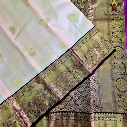 A elegant Cream Beige / Soft Sandal body with a rich Maroon Korvai Border Saree