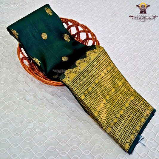 A deep Bottle Green with luxurious gold zari weaving Saree