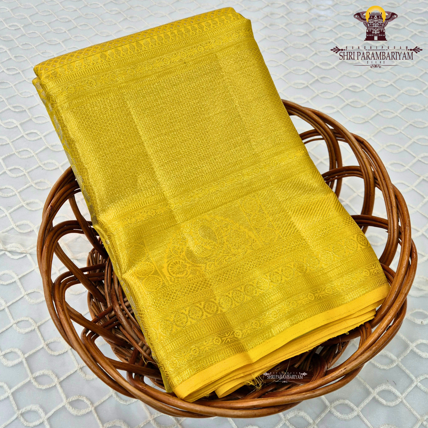 A vibrant bright golden yellow shade that radiates traditional elegance and festive Saree