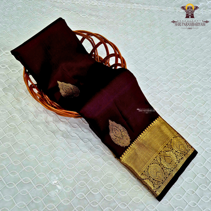 A rich Wine Maroon / Deep Burgundy with a subtle dual-tone silk sheen Saree