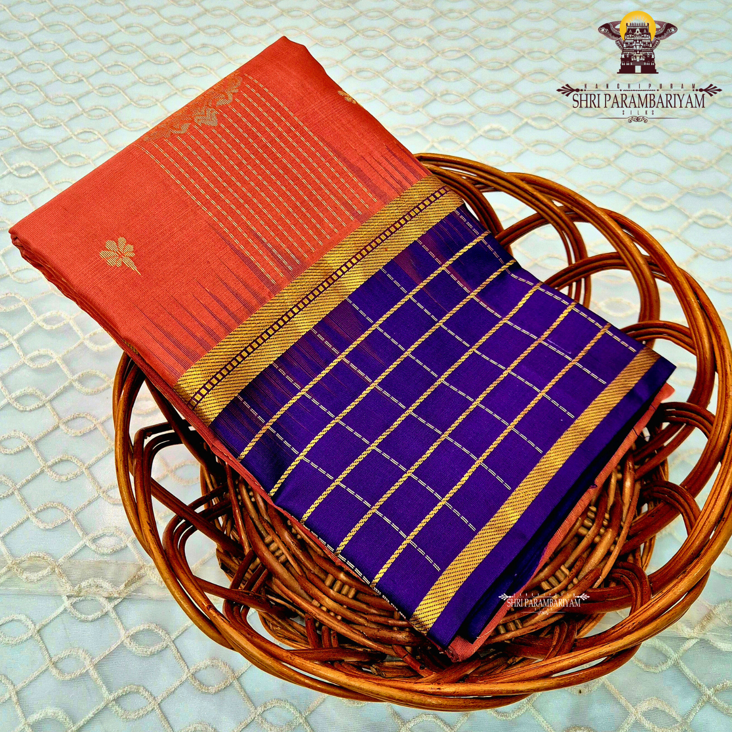 A striking reddish-orange (rust orange) Saree