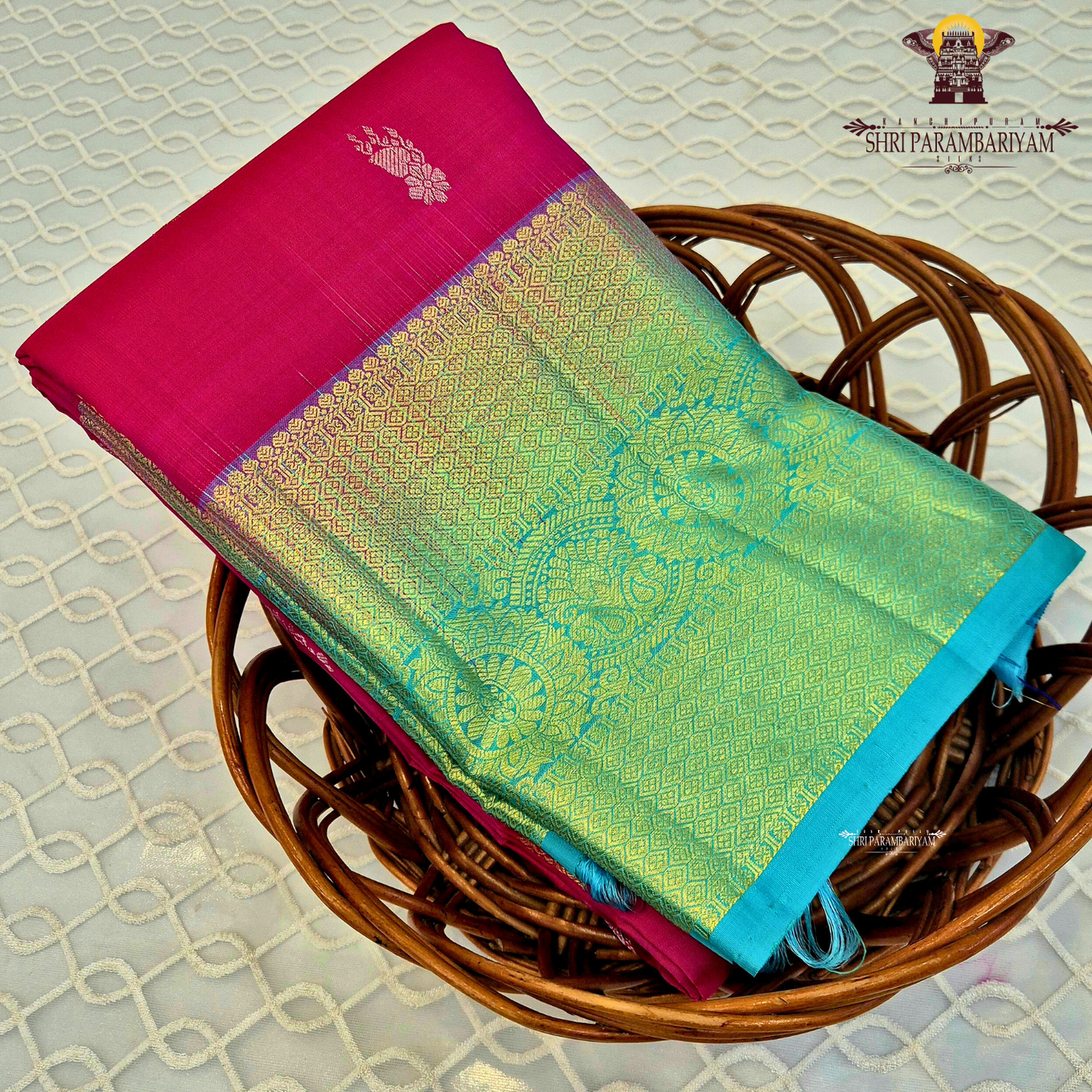 Bright Rani Pink body with a contrasting Peacock Blue / Aqua Green Saree