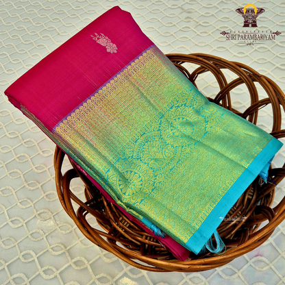 Bright Rani Pink body with a contrasting Peacock Blue / Aqua Green Saree