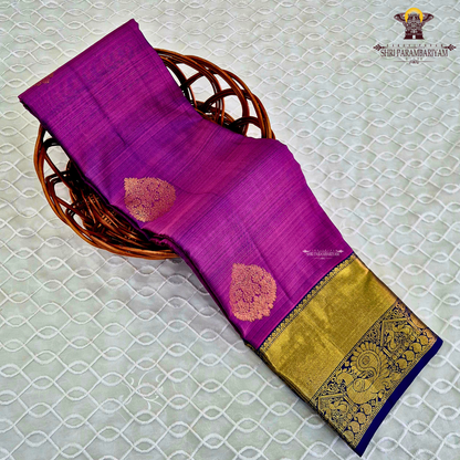 A vibrant magenta purple shade, featuring elegant zari Saree