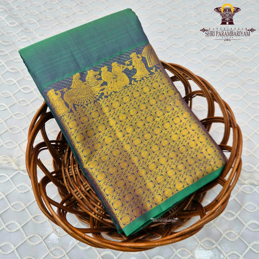 A elegant Dual-tone Teal Green with Royal Blue and Antique Gold Zari Saree