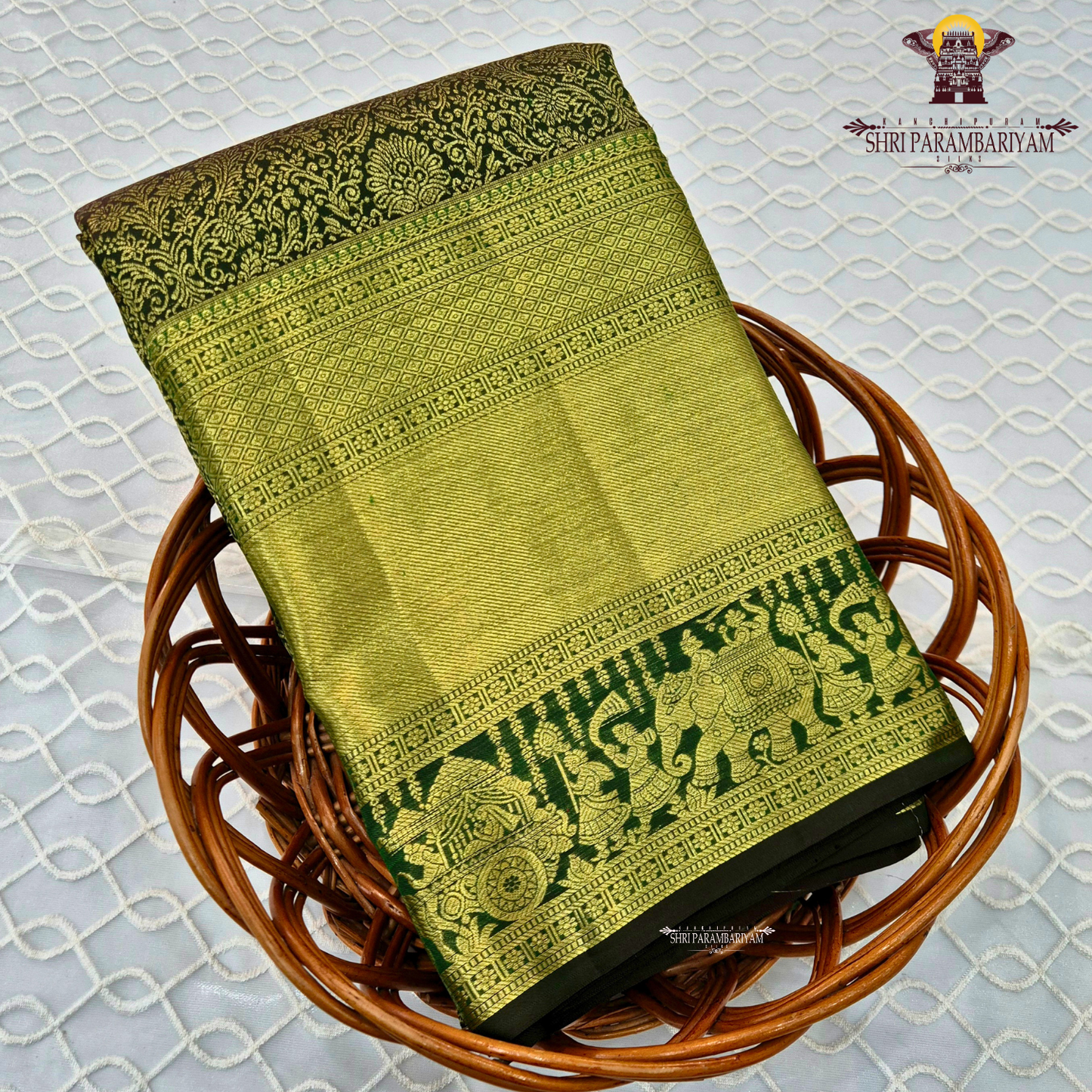 A rich dual-tone combination of olive green and antique gold Saree