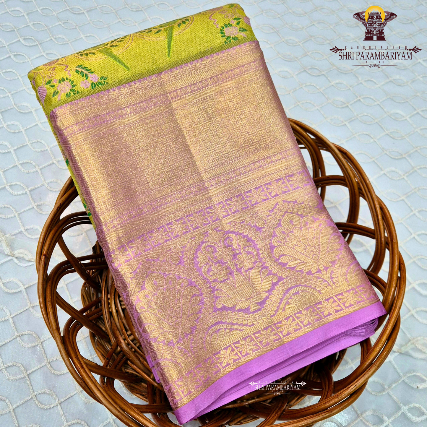 A vibrant and eye-catching combination of parrot green and rich lavender pink Saree
