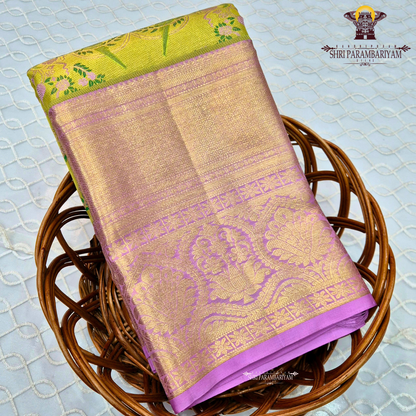 A vibrant and eye-catching combination of parrot green and rich lavender pink Saree