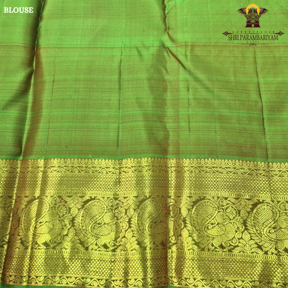 A elegant bright rani pink with rich gold zari border and a hint of green edging Saree