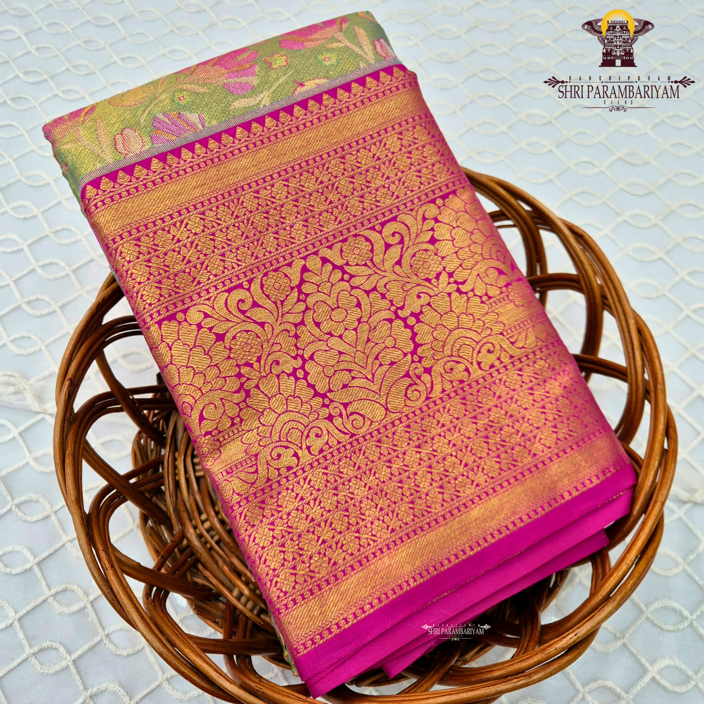 A beautiful parrot green / light leaf green body paired with a striking rani pink border Saree
