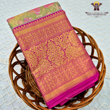 A beautiful parrot green / light leaf green body paired with a striking rani pink border Saree