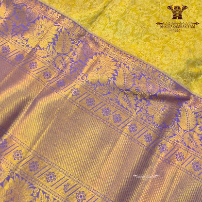 A rich combination of royal purple (violet) body with antique gold tissue Saree