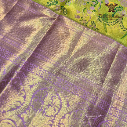 A vibrant and eye-catching combination of parrot green and rich lavender pink Saree