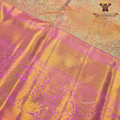 A beautiful peach gold body that shines with a luxurious tissue finish Saree