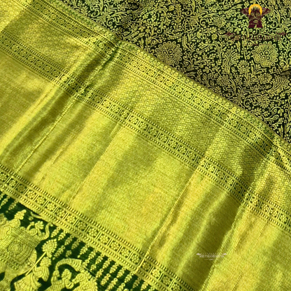 A rich dual-tone combination of olive green and antique gold Saree