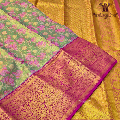 A beautiful parrot green / light leaf green body paired with a striking rani pink border Saree