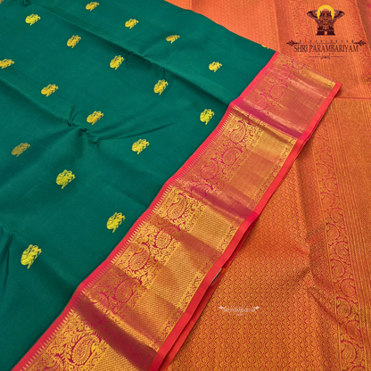 A traditional bottle green silk saree beautifully enhanced with pure gold zari weaving Saree