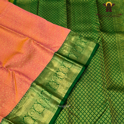 A beautiful peachy coral orange body with intricate gold zari Saree