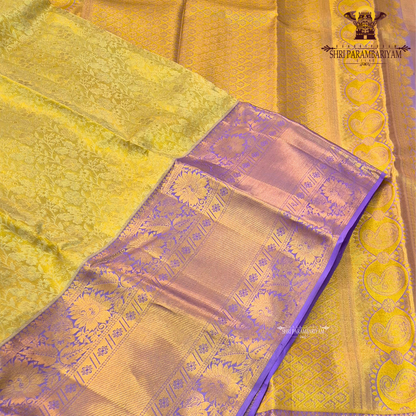 A rich combination of royal purple (violet) body with antique gold tissue Saree