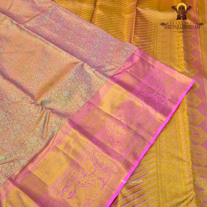 A beautiful peach gold body that shines with a luxurious tissue finish Saree