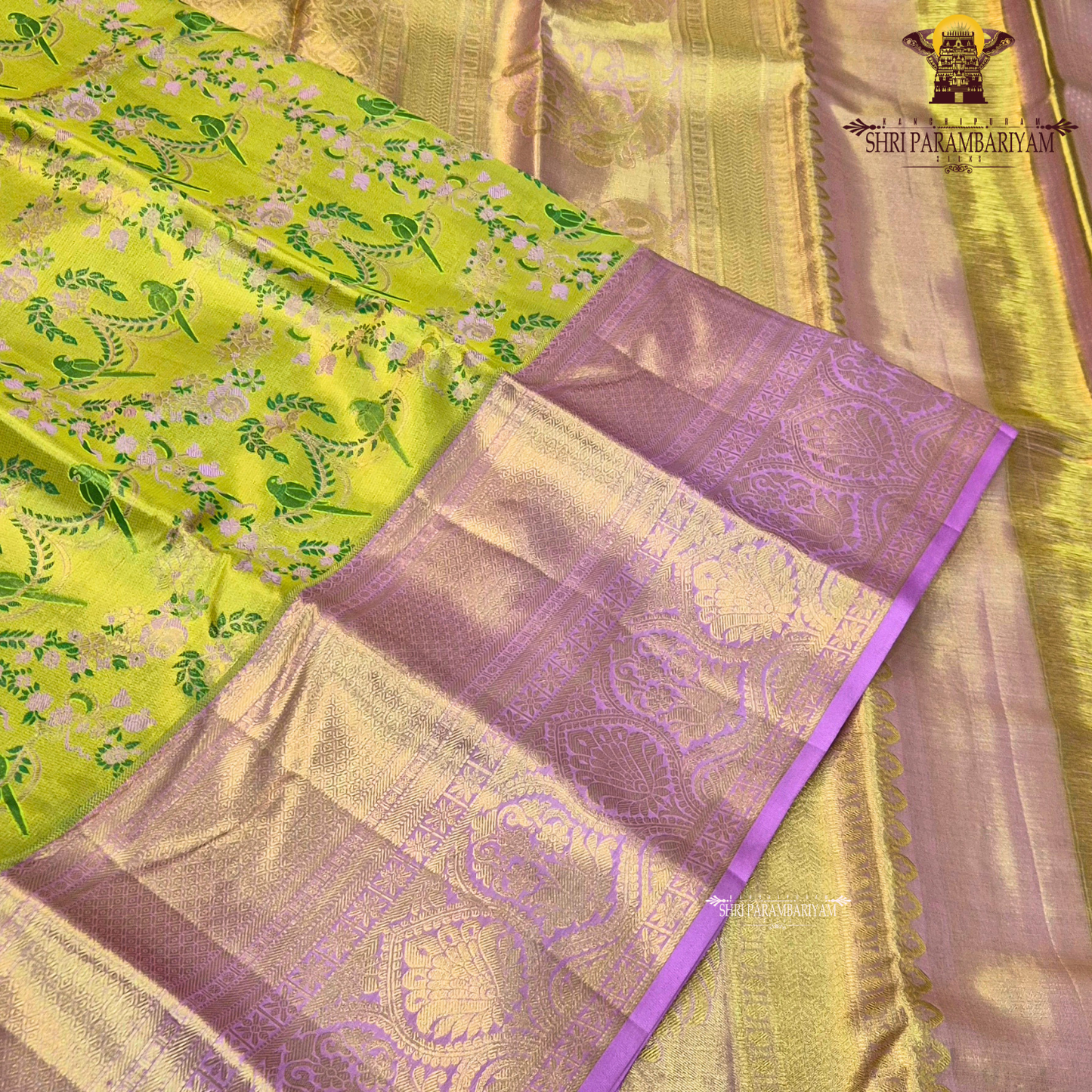 A vibrant and eye-catching combination of parrot green and rich lavender pink Saree