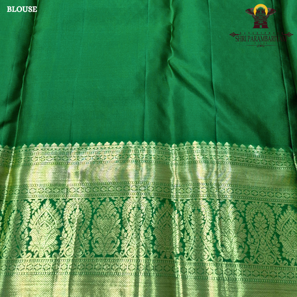 A beautiful peachy coral orange body with intricate gold zari Saree