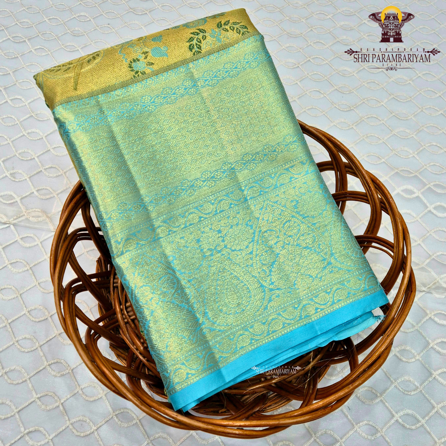 A refreshing combination of aqua blue (turquoise) and antique gold Saree