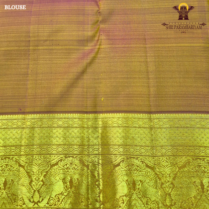 A bright turmeric yellow with rich gold zari border and a subtle maroon edging Saree
