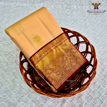 A classic Ivory Cream / Off-White body with a rich Maroon Korvai Border Saree