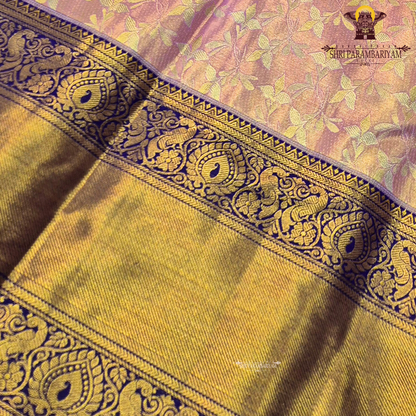A soft and elegant peach / pastel rose gold body paired with a rich royal blue (navy blue) border Saree
