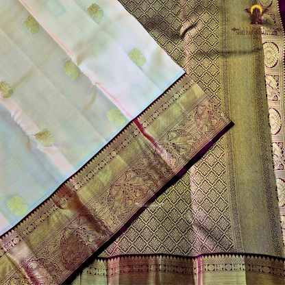 A classic Ivory Cream / Off-White body with a rich Maroon Korvai Border Saree