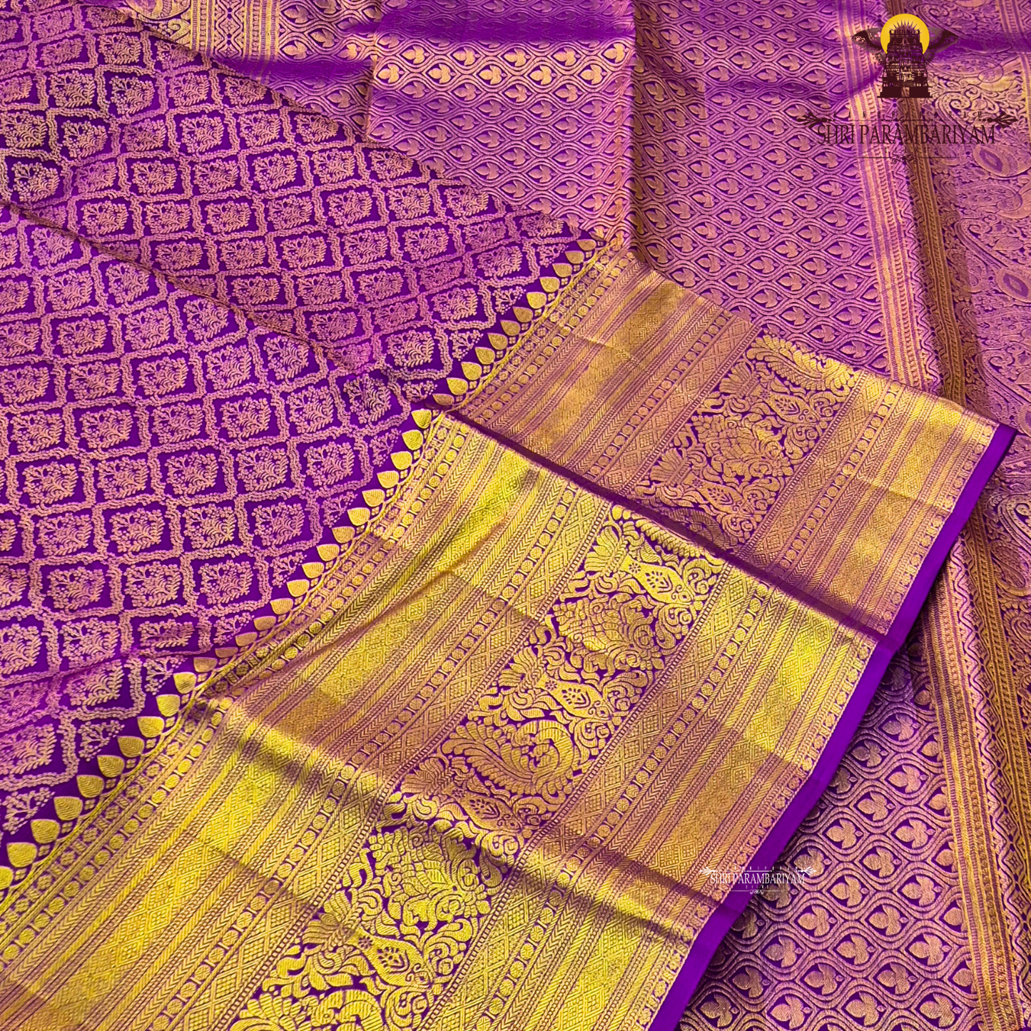 A vibrant purple and gold combination, with a rich golden zari Saree