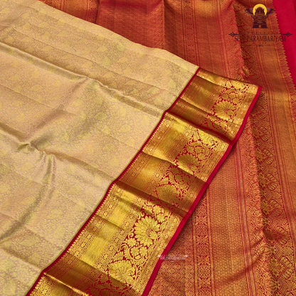 A soft pastel peach body paired with a rich deep red korvai border Saree