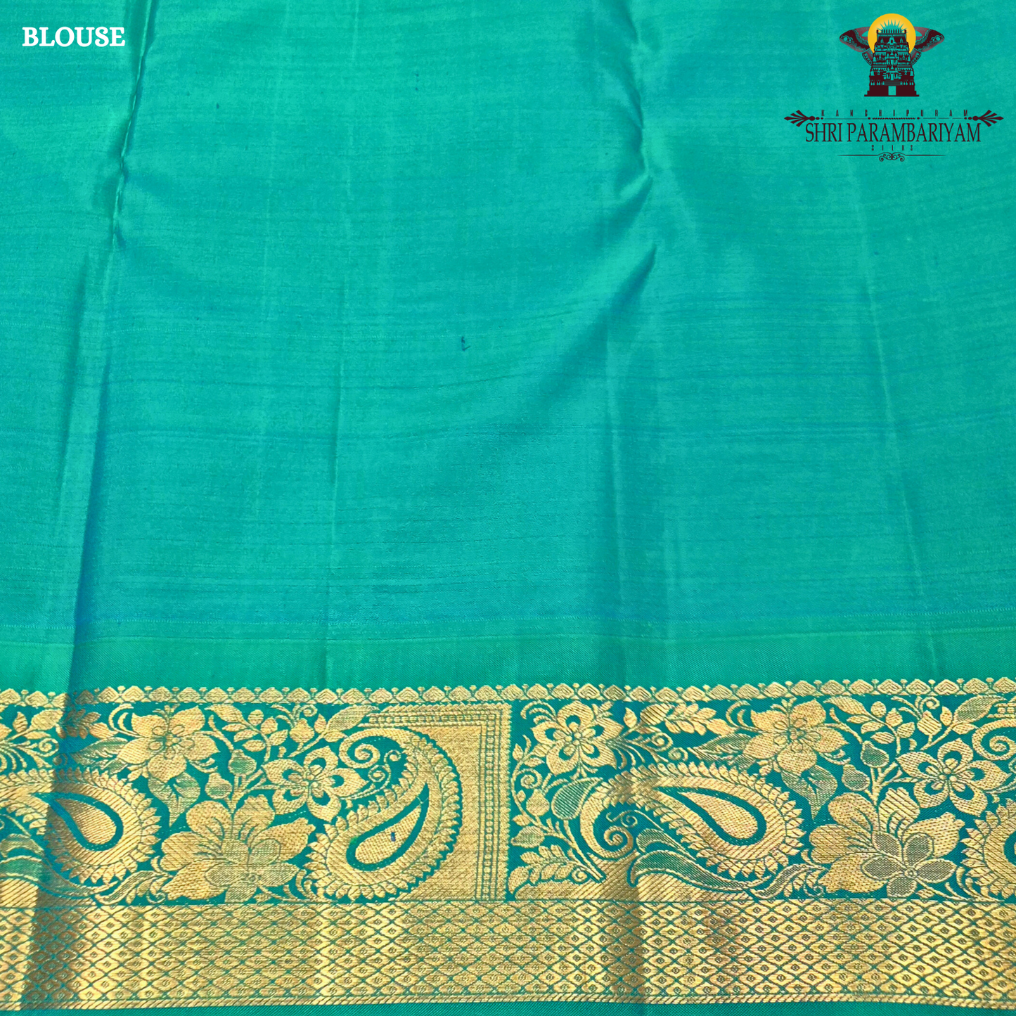 A rich deep magenta (pinkish-maroon) body paired with a peacock green border Saree