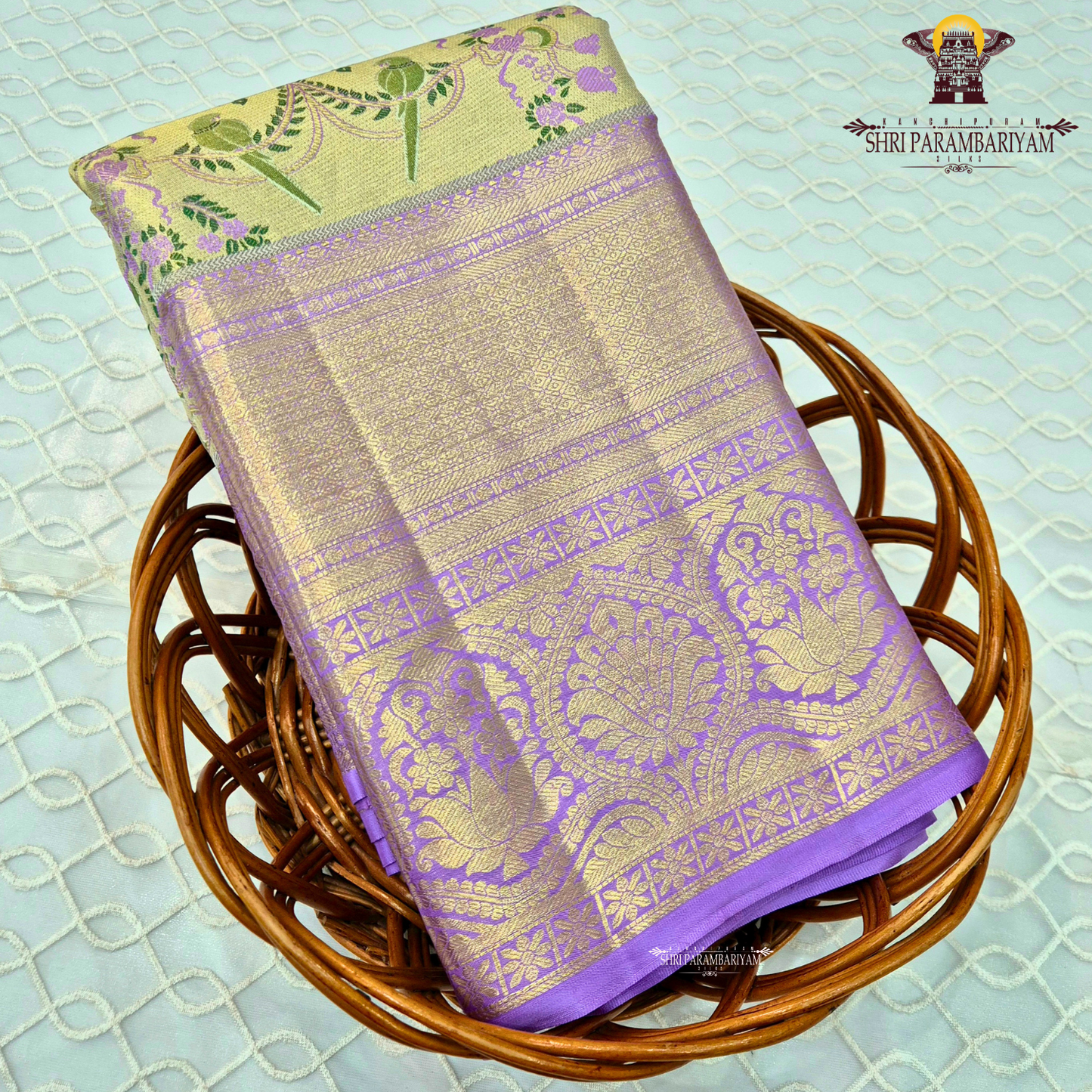 A graceful dual-tone combination of pastel pista green and soft lavender purple Saree