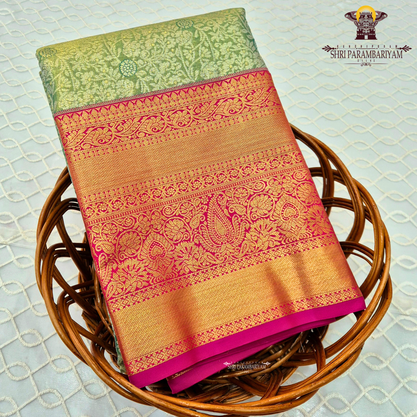 A refreshing pastel pista green body with a subtle sheen Saree