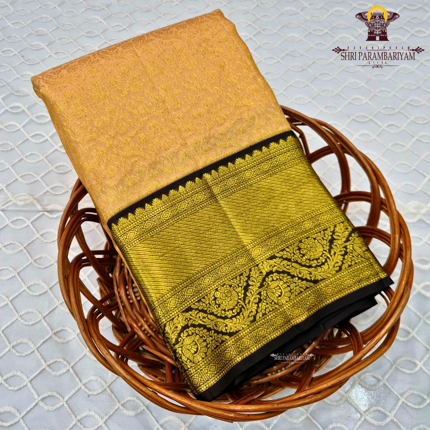 A soft beige gold body with a contrasting coffee brown korvai border enriched Saree