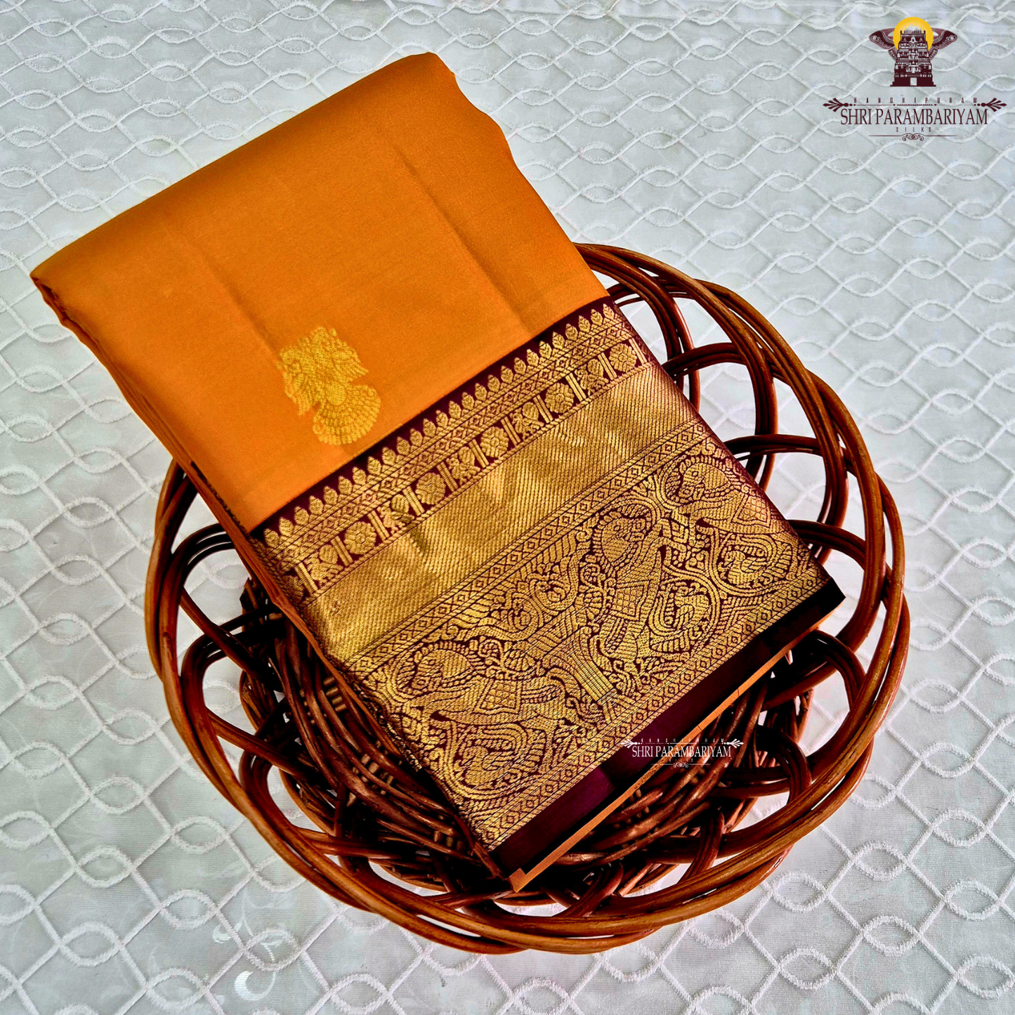 A radiant Mustard Orange / Marigold Orange body with a rich Maroon Korvai Border Saree