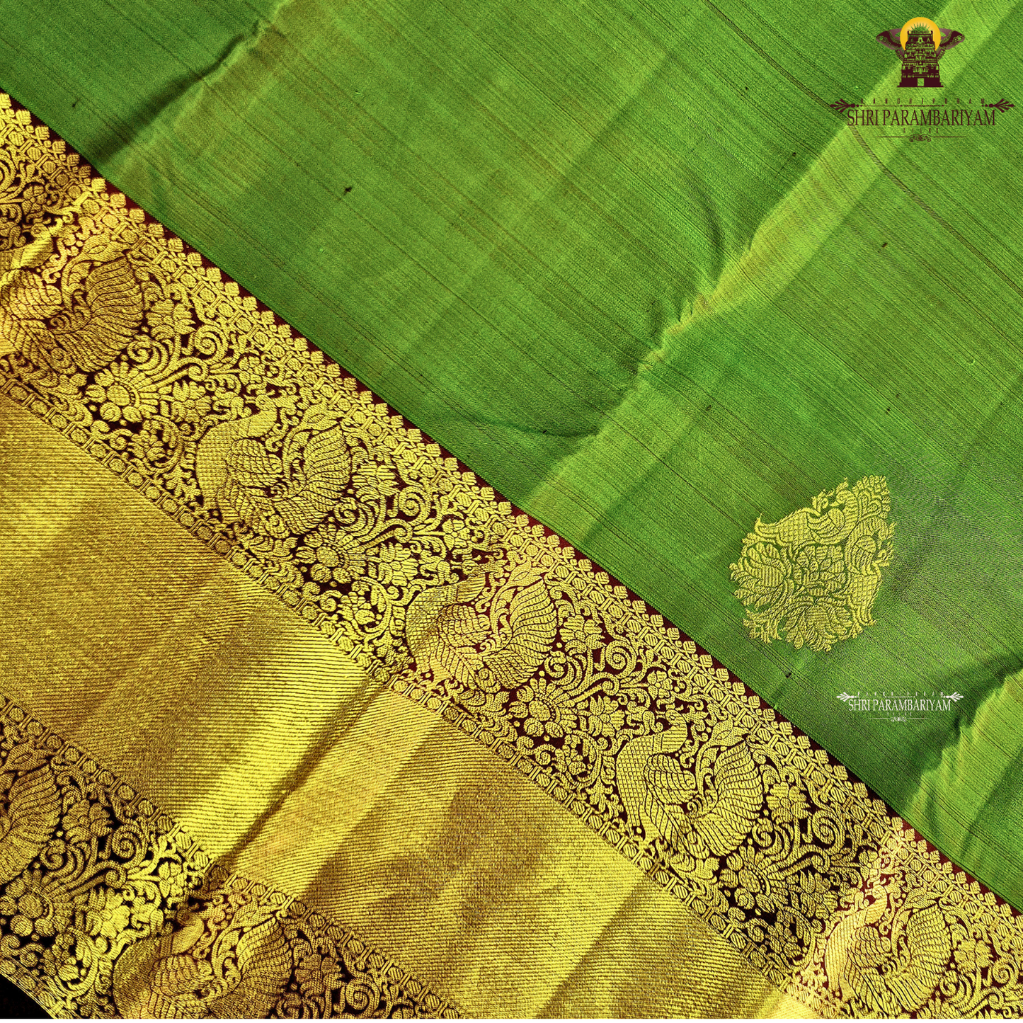 A parrot Green with Rich Gold Zari and Maroon Contrast Border Saree